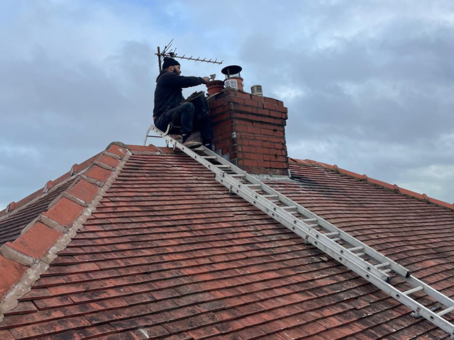 Lead flashing installation around chimney by Blackpool Roofer