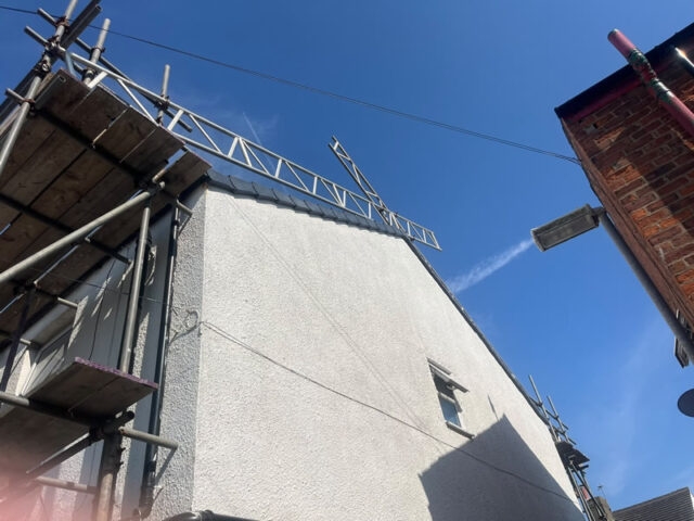 Grey Marley concrete flat tiles being installed in Blackpool